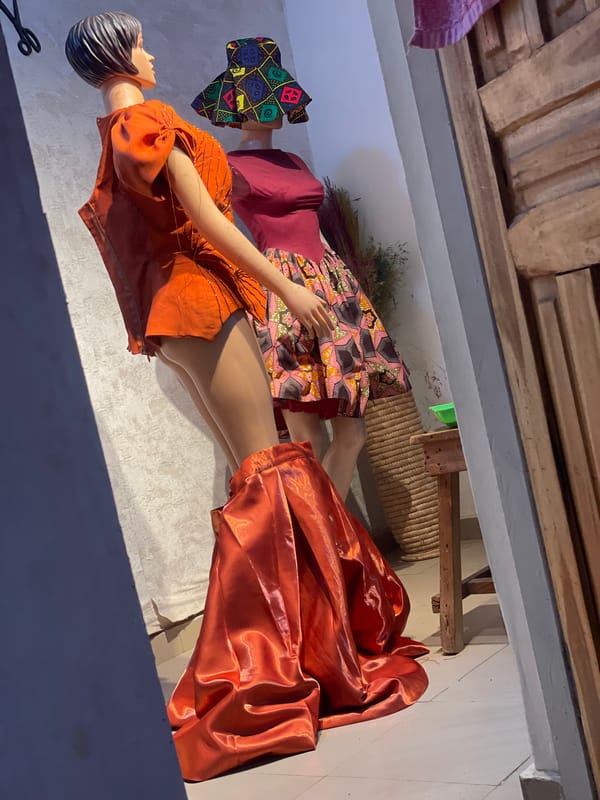 Traditional Nigerian clothing displayed on mannequins in Egan