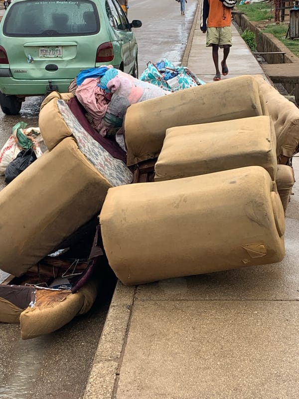 Ordinary street life documented across Jos, Nigeria during rainy morning