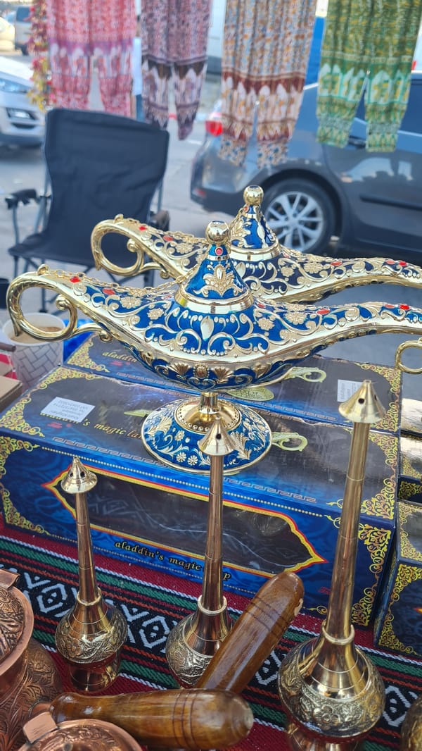 Vendor displays ornamental magic lamps at Kiryat Gat market stall
