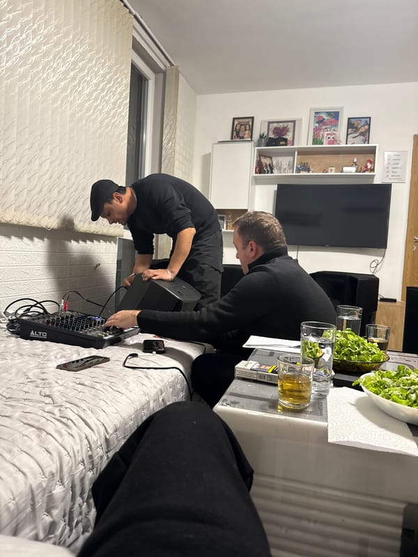 Two men set up DJ equipment at Sofia residence