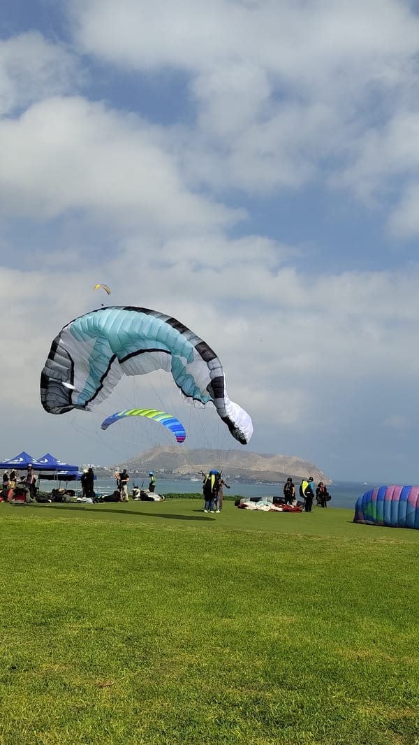 Paragliders soaring off the Miraflores cliffs over the Pacific