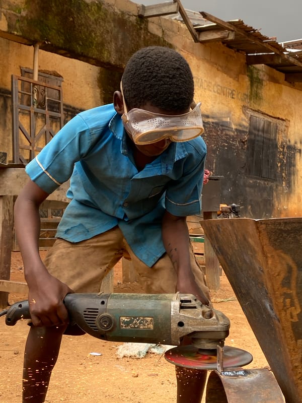 Young metalworkers and children captured in Kuru Dungus, Nigeria