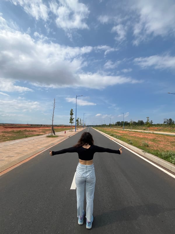 Posing on an empty road in Mui Ne, Vietnam