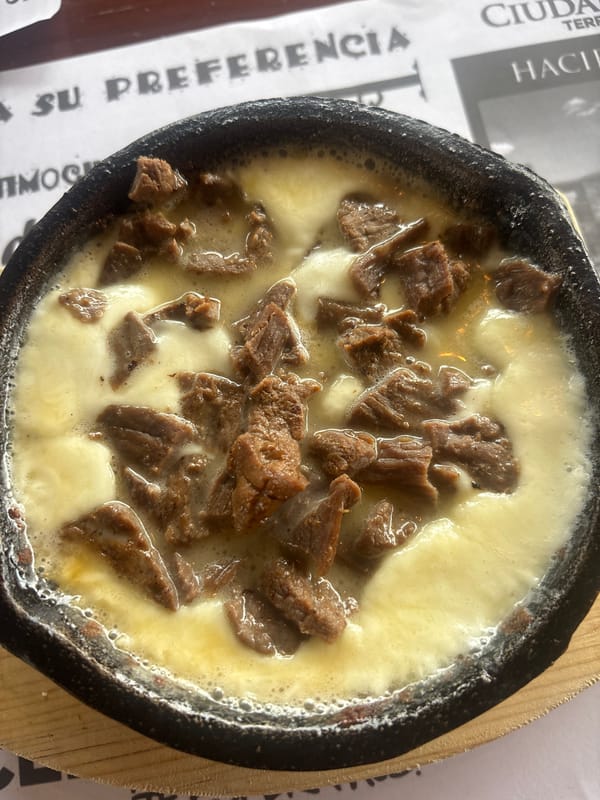 Hot beef cheese dish served in Puebla skillet