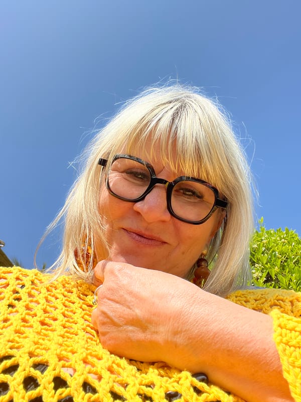 Woman in yellow photographed outdoors in Grimaud, France