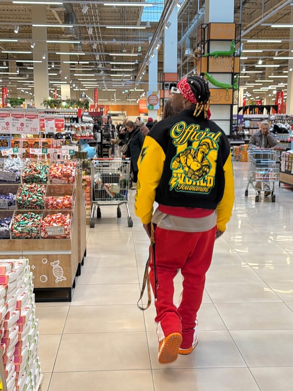 Shopper browses candy aisle at Kommunarka grocery store