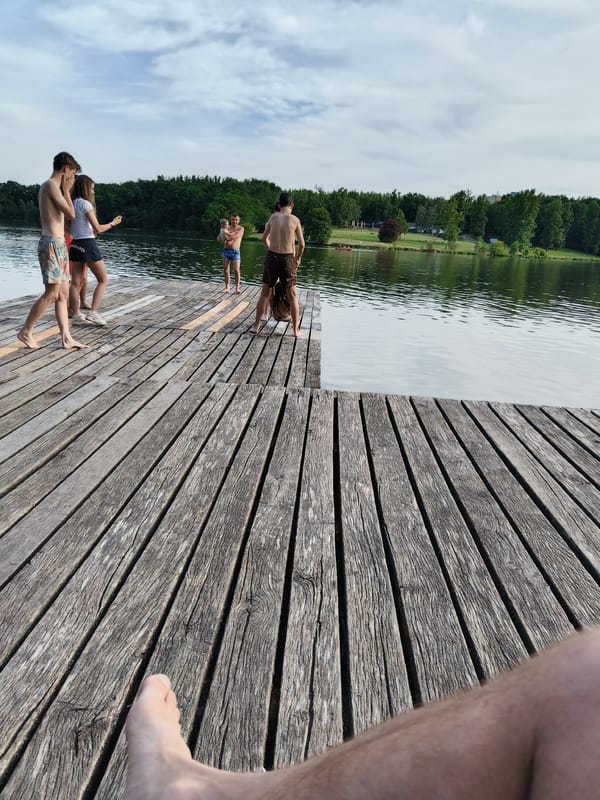 Young people gather at Prague lake pier for swimming