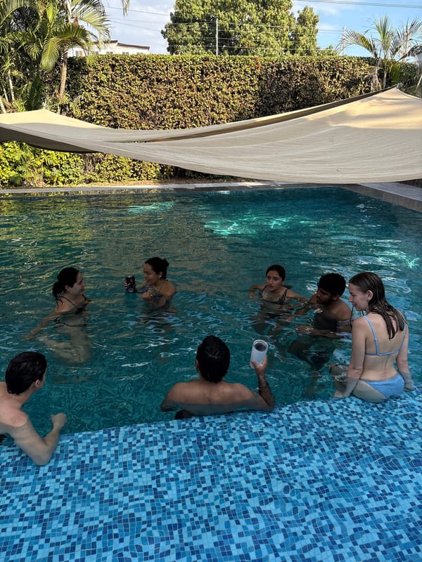 Group of young adults enjoys evening pool gathering in Mexico