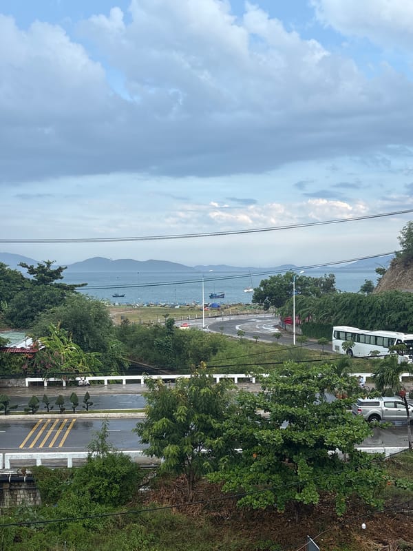 Nha Trang's coastal streets and canal on a grey morning
