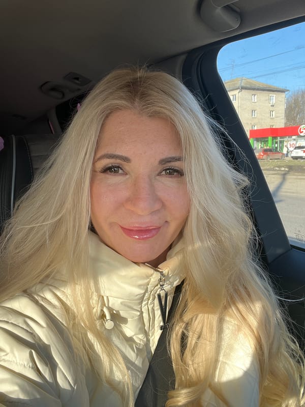 Woman smiling in car in Nizhny Novgorod