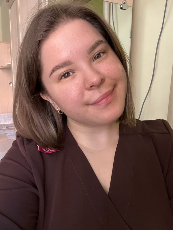 Healthcare worker takes selfies in MedPlus uniform in Kazan