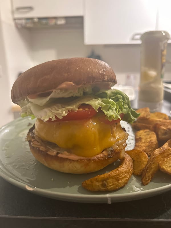 Burger meal with potato wedges served in Pantin, France