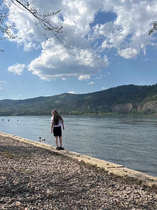 Woman spotted at riverside embankment in Овсянка, Russia