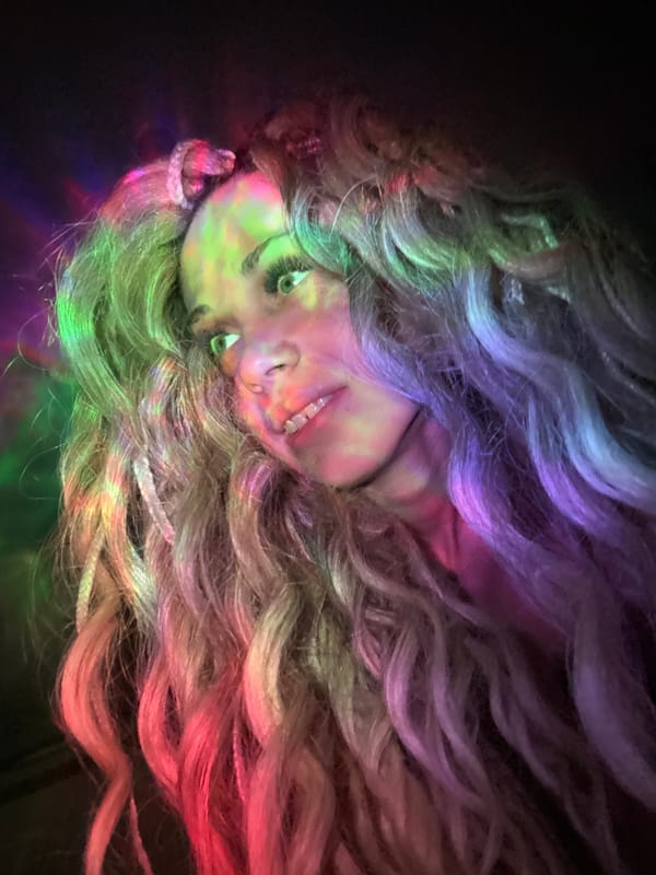 Woman photographed under colored lighting in Rusanovo, Russia