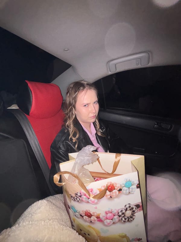 Young women take casual photos in car, nighttime scene in Foki