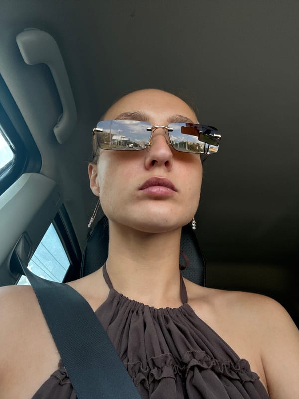 Passenger selfies in Izhevsk, sunglasses reflecting the street