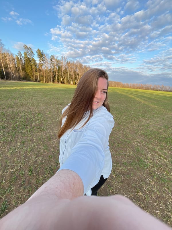 Woman documents rural field visit with selfies in Раздолье