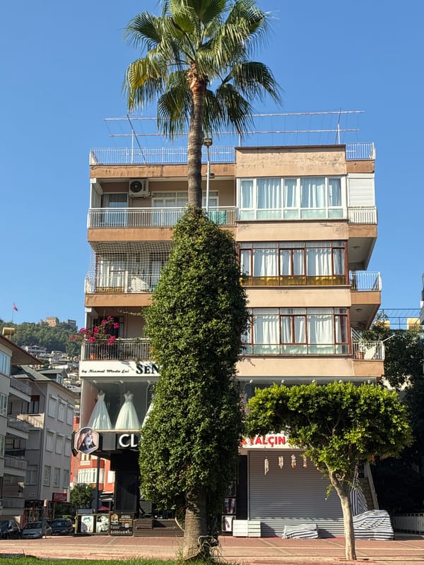 Early morning street scene across a commercial block in Alanya