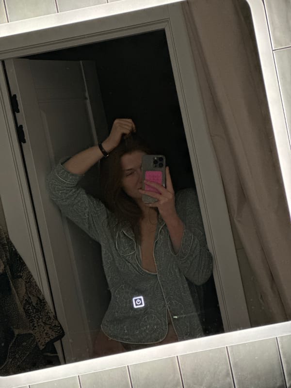 Woman takes bathroom selfies in paisley pajamas, Kazan