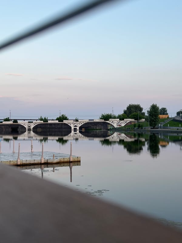 Evening waterfront walk along Votkinsk embankment captures sunset reflections