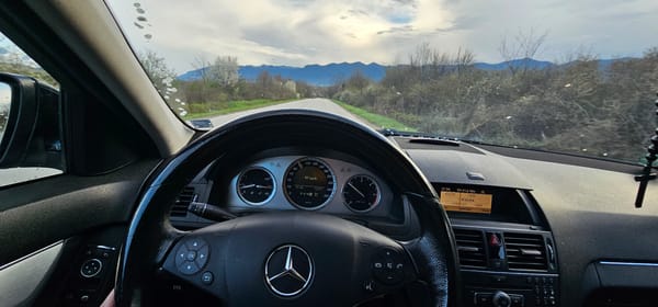 Driver captures mountain road view near Nefela, Bulgaria