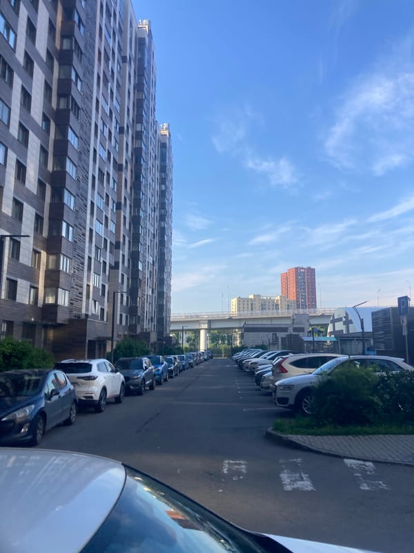 Moscow resident documents sunny daytime walk through city neighborhoods