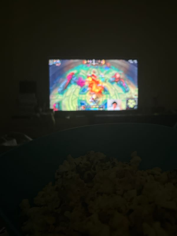 Late night gaming session with popcorn snack