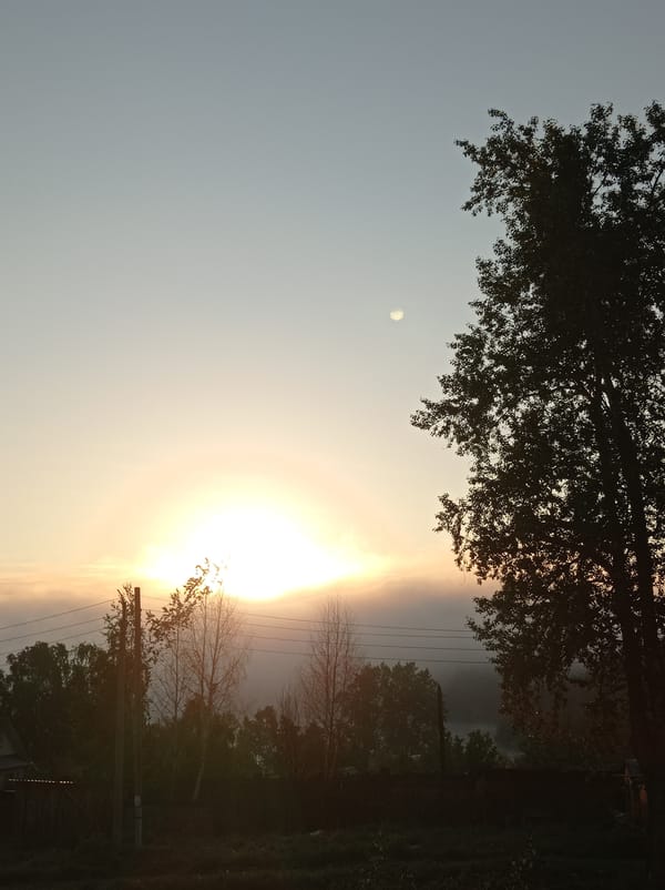 Dawn breaks through fog and clouds in Degtyarsk, Russia