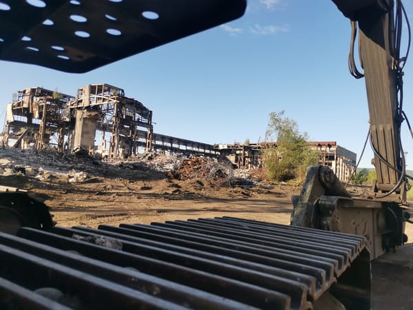 Industrial demolition underway in Zhivkovo, Bulgaria with heavy machinery