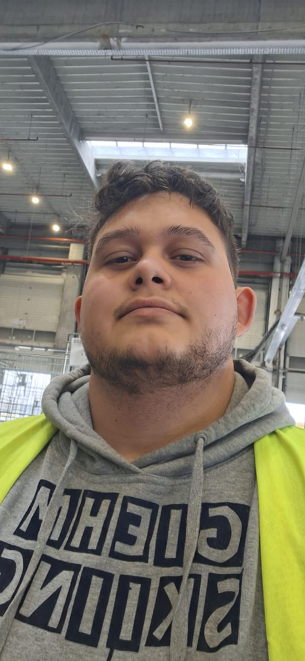 Person in grey hoodie spotted inside industrial building