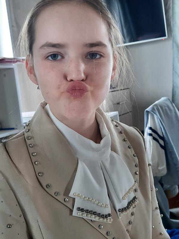 Person in decorative beige jacket photographed in Krasnogorskoye, Russia