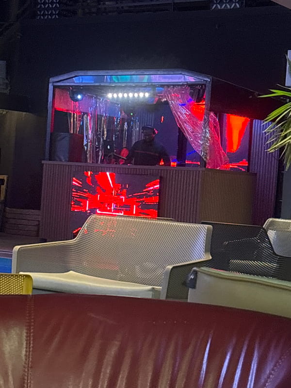 DJ set, soccer screening, and gaming at a Gura Top night venue