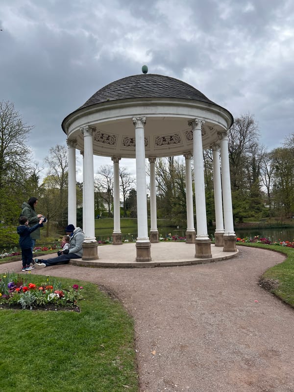 Park visitor takes selfies near gazebo in Strasbourg
