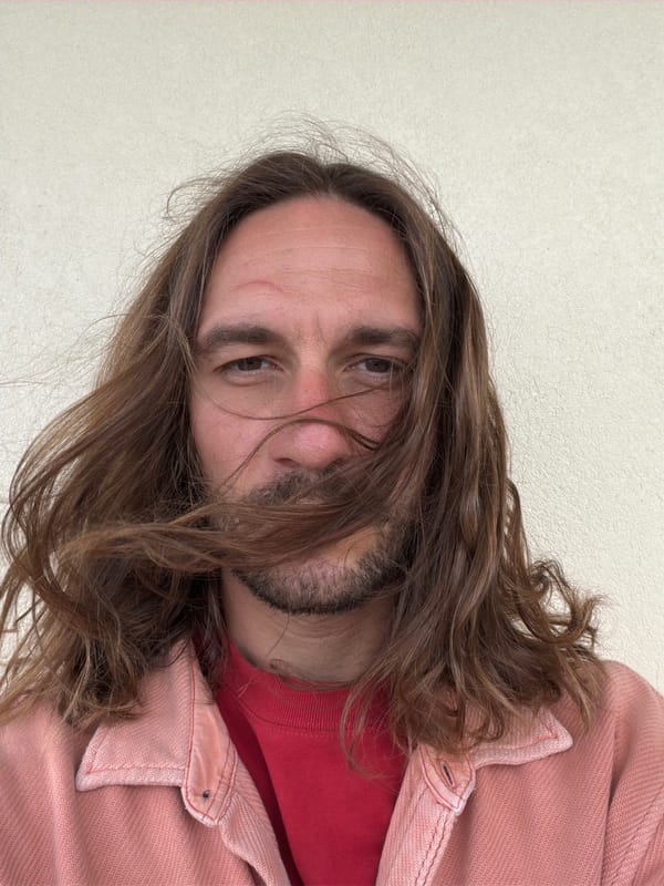 Bearded man in pink clothing observed in Pokhara, Nepal