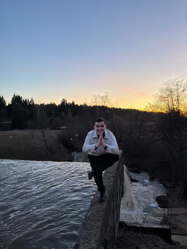Young man photographed on stone wall in Kamennoye, Russia