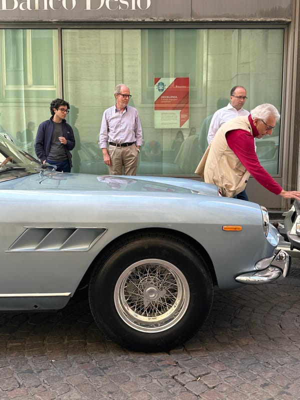 Classic cars draw crowds on Milan street near bank