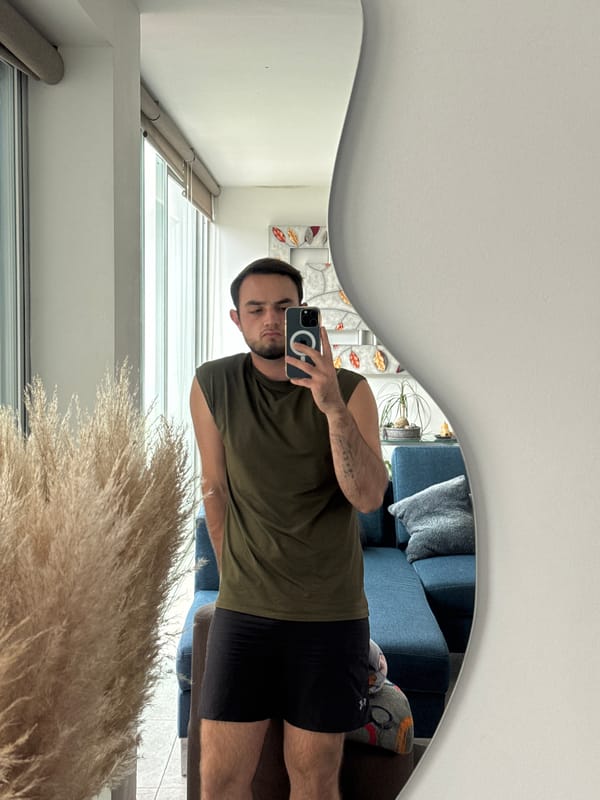 Man takes mirror selfie in Mexican home