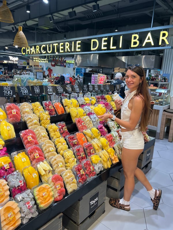 Supermarket browse in Ko Samui covers fruit, sushi, and spirits