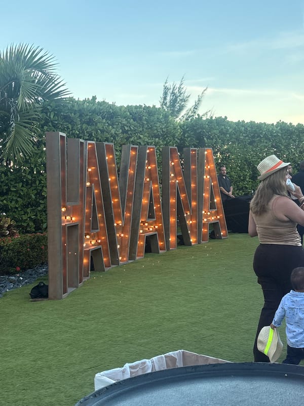 Illuminated AWAKEN sign spotted at Miami Beach outdoor event