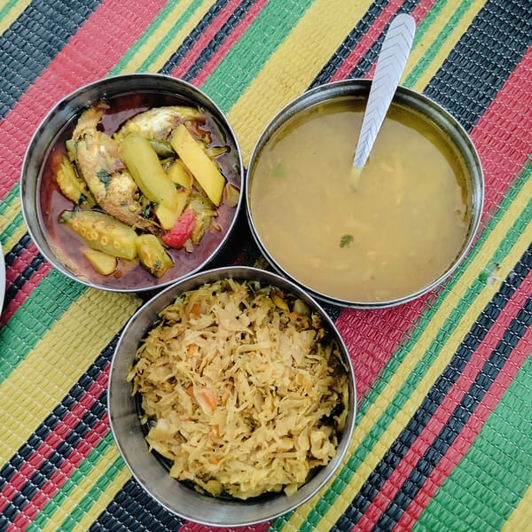 Casual meal with cat in Dhaka garage setting