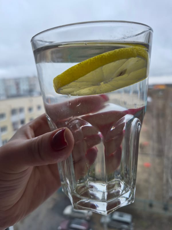Woman takes selfie with drink in early morning Tobolsk