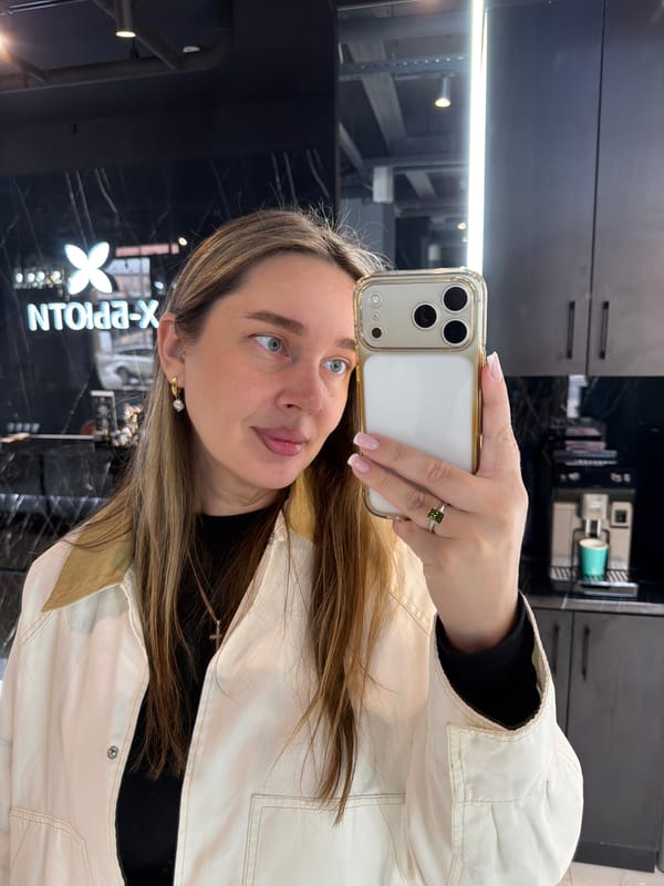 Woman takes multiple mirror selfies in upscale Moscow location