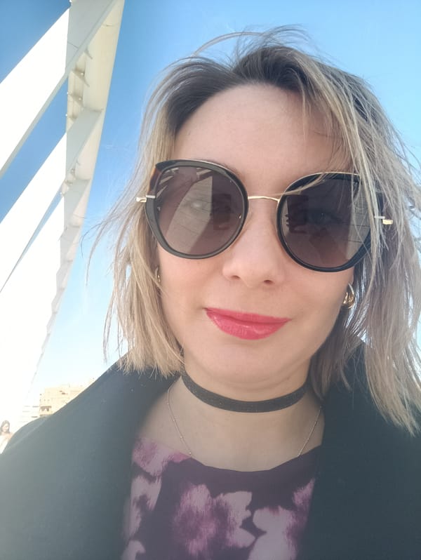 Woman takes selfie at Valencia's Pont de l'Exposició bridge