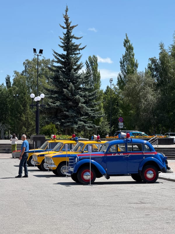 Vintage cars and retro police motorcycle on display in Omsk