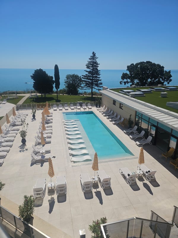 Touring a modern resort property on a sunny morning