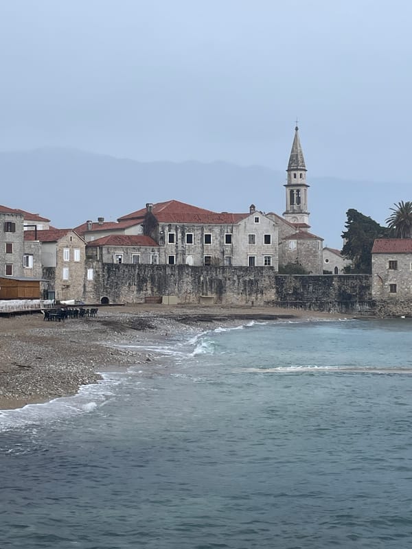 Tourist captures Budva's Old Town and famous ballerina statue