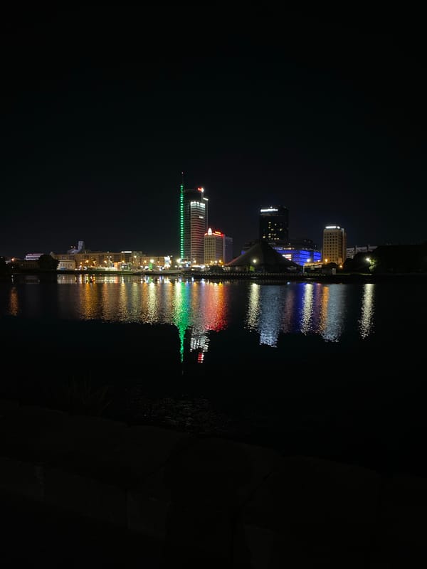 Minsk city lights reflecting on water at night