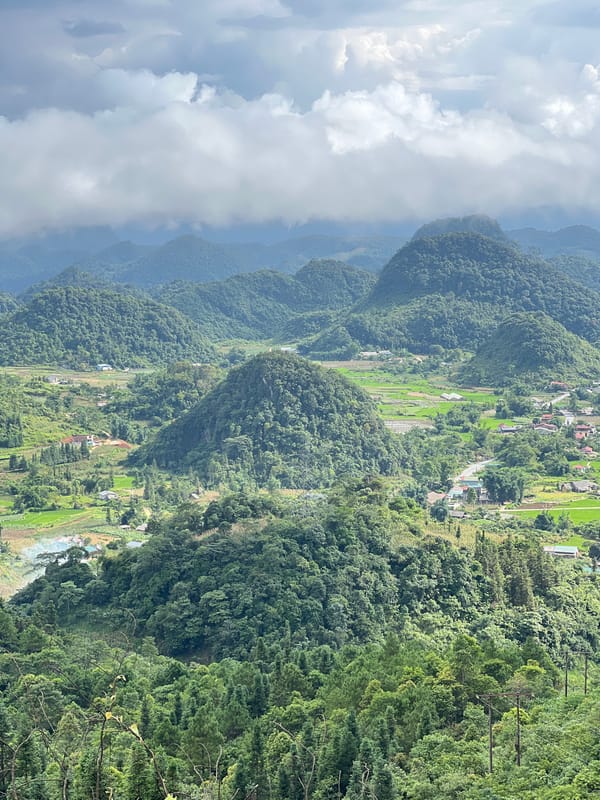 Panoramic views over Quản Bạ's layered green hills