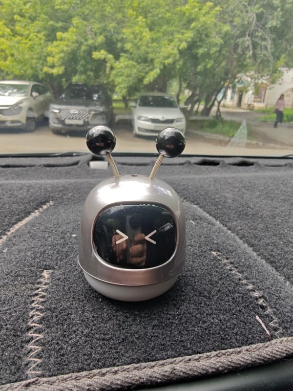 Dashboard robot ornament and radio display in a Chelyabinsk car