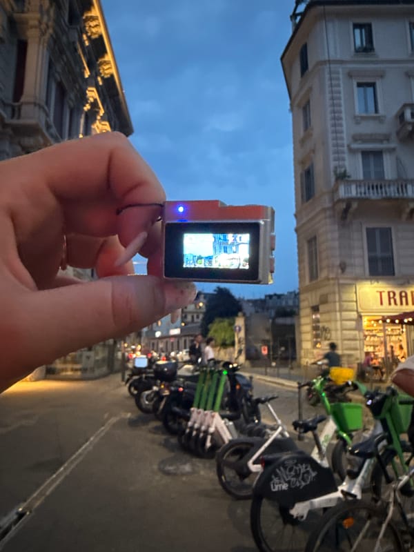 Testing a small action camera on Milan streets at dusk